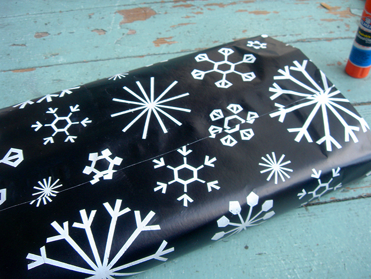 Glue around the edges of wrapping paper.