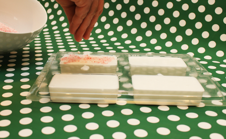 Cover the top of your soap with the candy cane pieces.