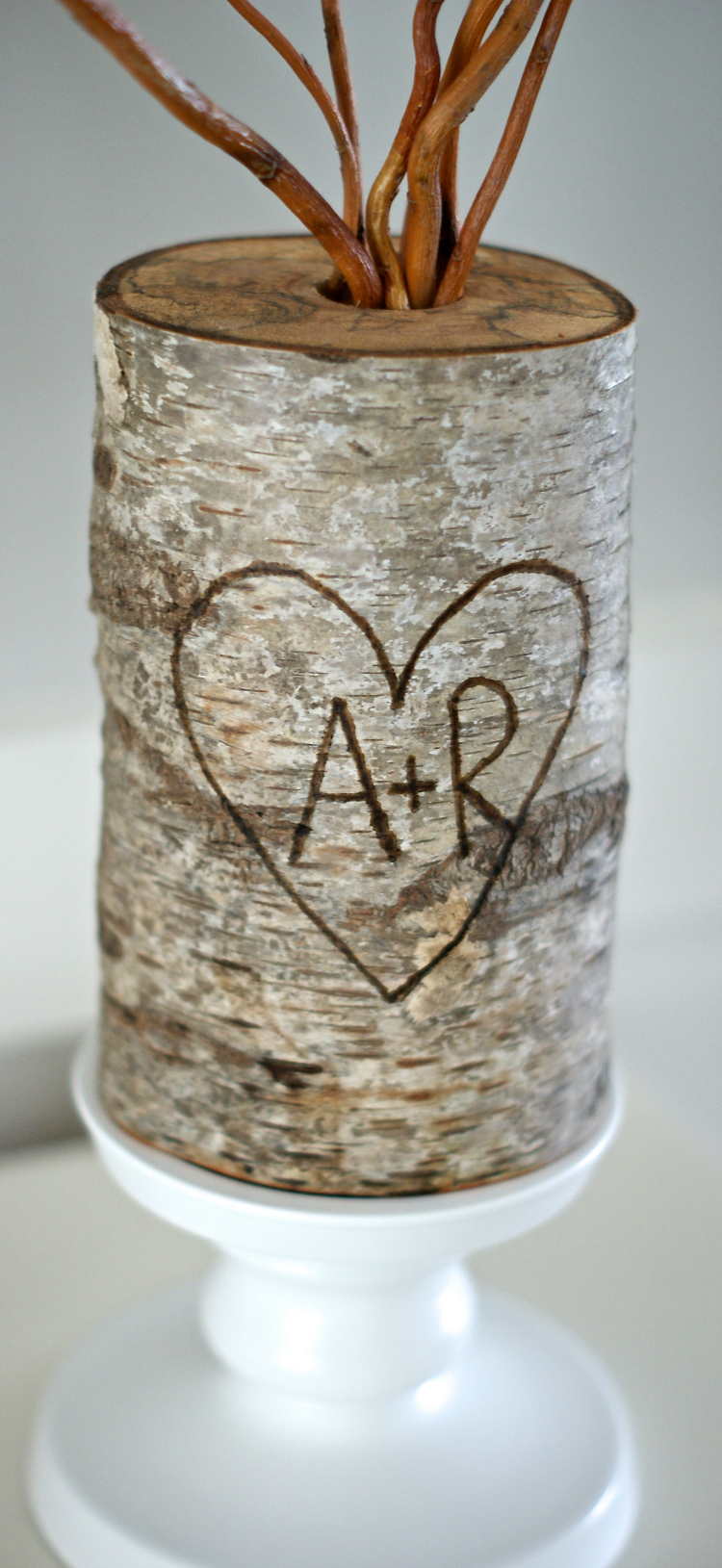 Add a finish to the top of your log and branches, and arrange them in your log vase.
