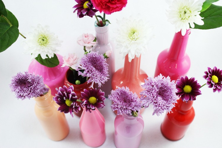 Turn glass bottles into beautiful vases with this easy painting technique. These bud vases will add a pop of color to your home decor.