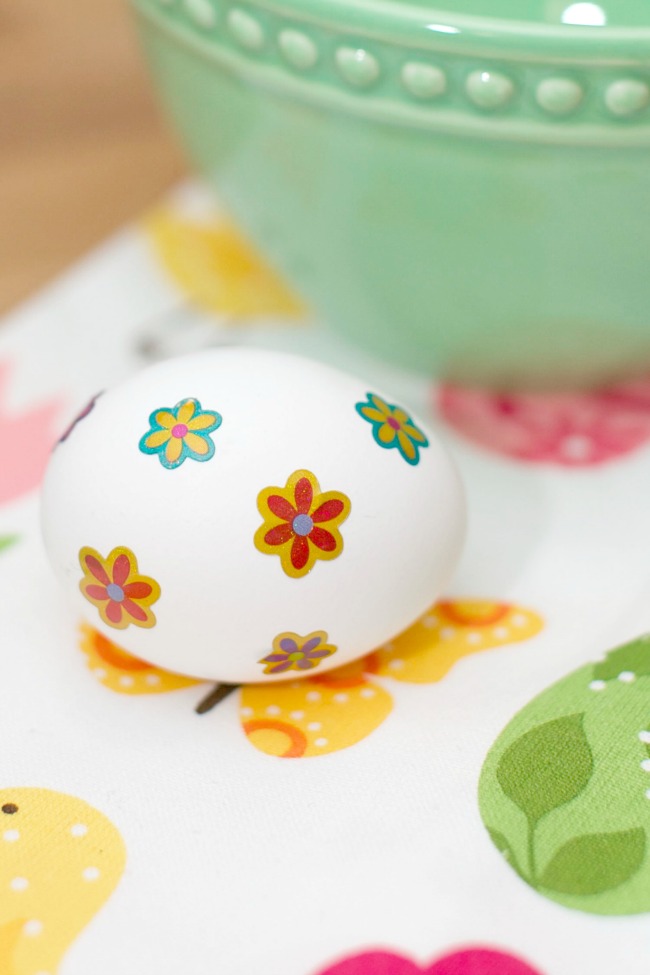 Adding stickers to your hard boiled eggs is the first step in this fun and unique Easter egg dying technique. 