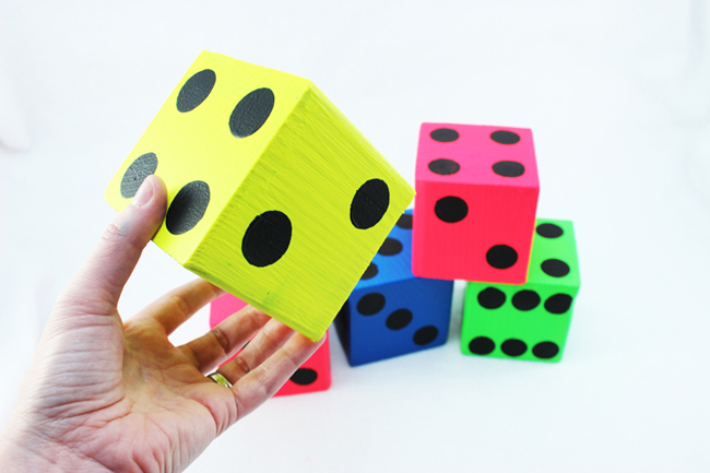 Make your own giant, brightly colored dice - perfect for yard yahtzee! 