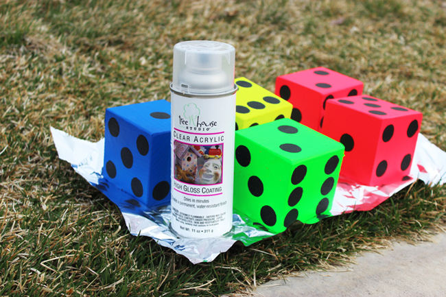 Seal your yard yahtzee dice with an acrylic spray - this will protect your color and make them shiny. 