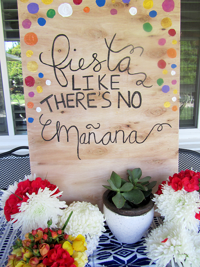 Use an old piece of wood to make a fun sign for your party. 
