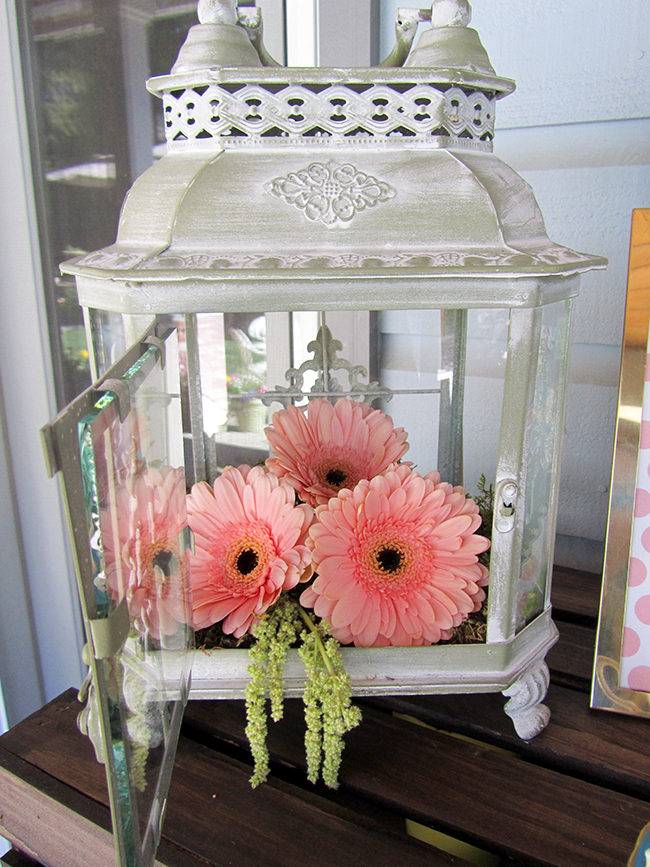 Love this lantern full of flowers for a wedding shower decoration. Super cute. 