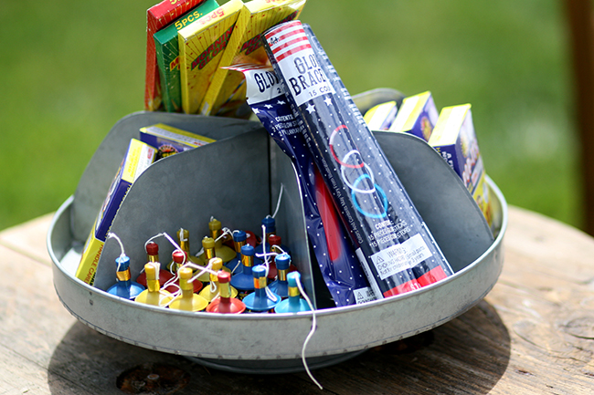 An old electrical spool is perfect for holding fireworks. Great upcycle idea! 