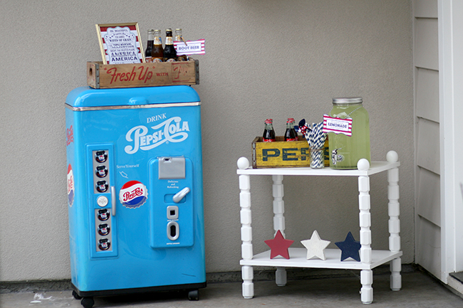July 4th party drink station with a vintage feel! I love this old refrigerator. Bottled cokes and lemonade are perfect refreshments for an outdoor summer party. 