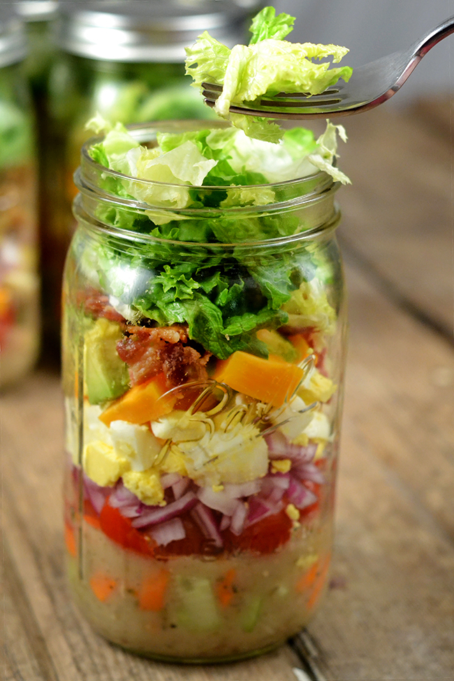This is how you make a mason jar salad. If you pack it in this order, it will be perfect when you open the jar and dump it in a bowl. 