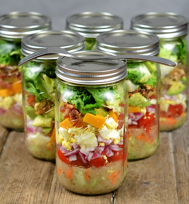 Mason Jar Salads are the perfect summer salad recipe. Make a week's worth over the weekend, and you will have an easy healthy lunch you can take to work with you each day.