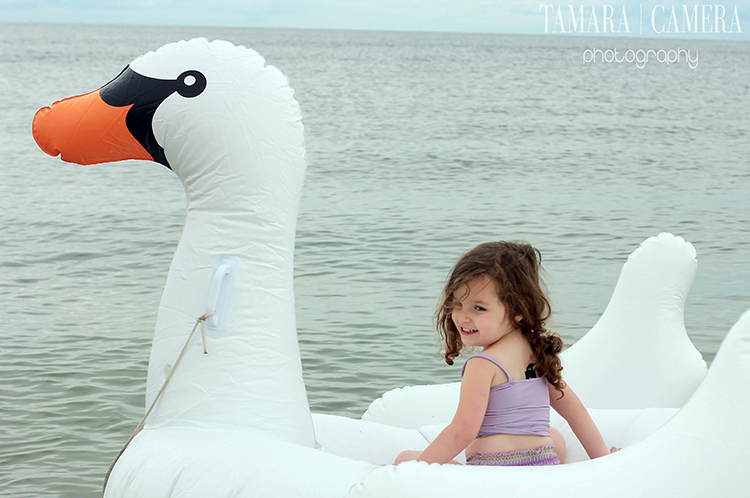 Little girl in a swan boat.
