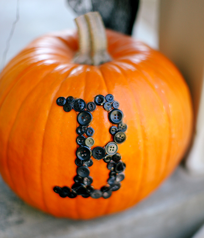 Use leftover buttons to create cute words on pumpkins!