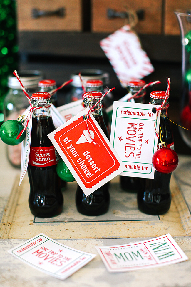A cute idea for secret santa - attach an ornament and a printable Christmas coupon to a Coke bottle for a cute gift. 