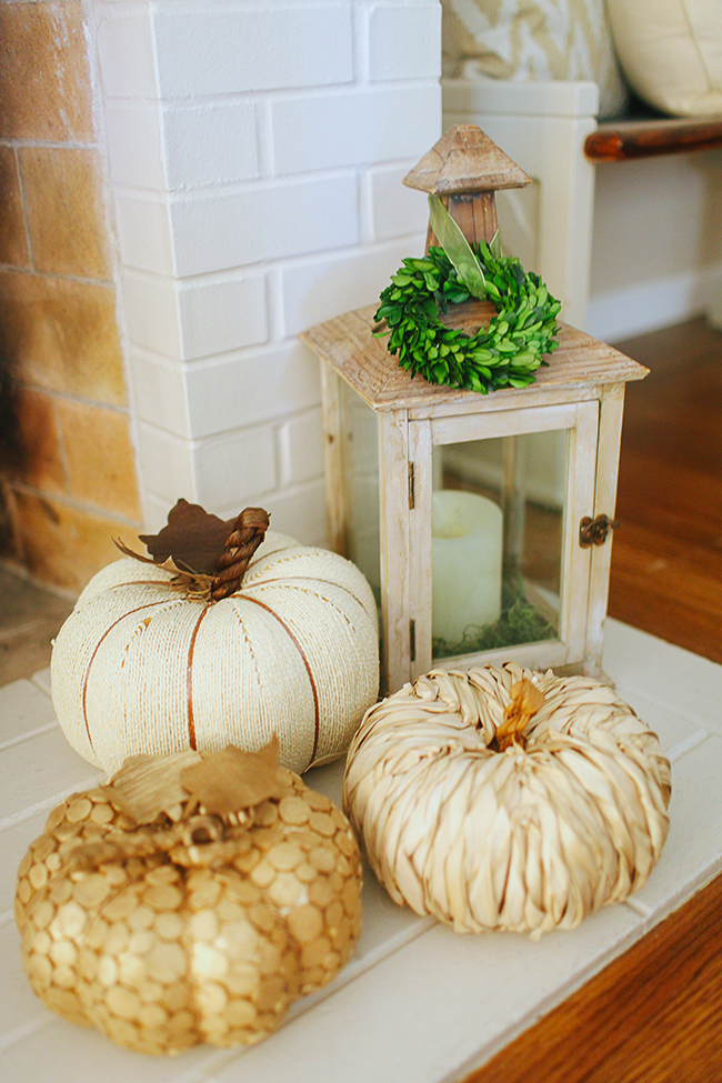 Use lanterns to bring the outside into your mantle decor.