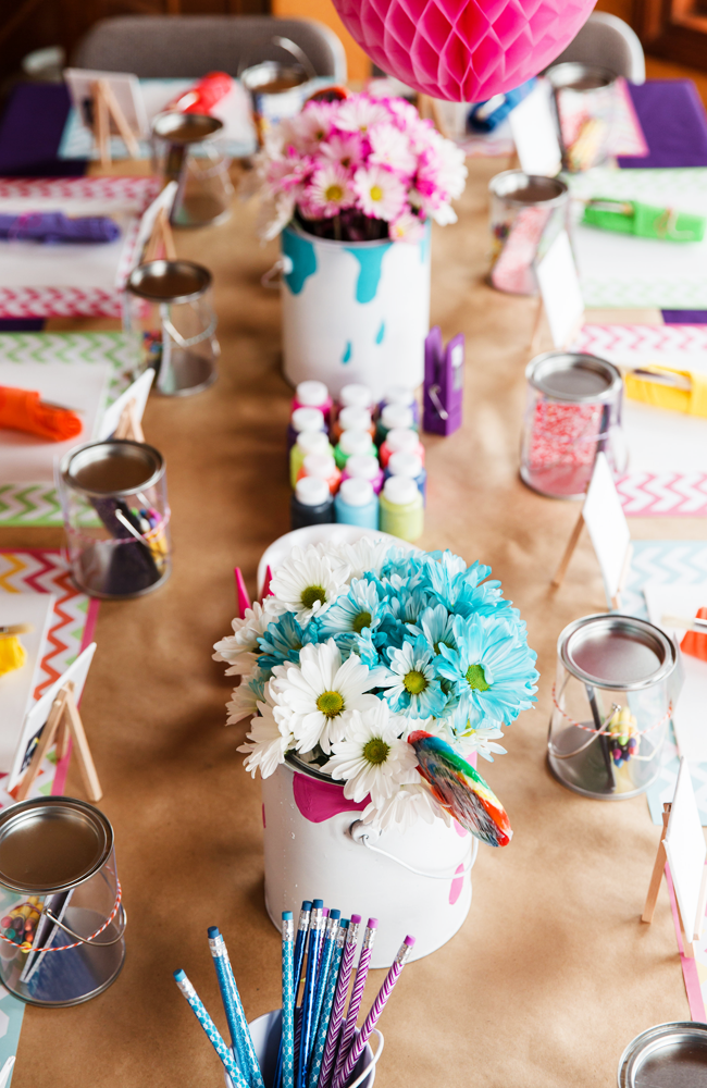 We love the use of bright fun flowers to brighten up this Art Party!