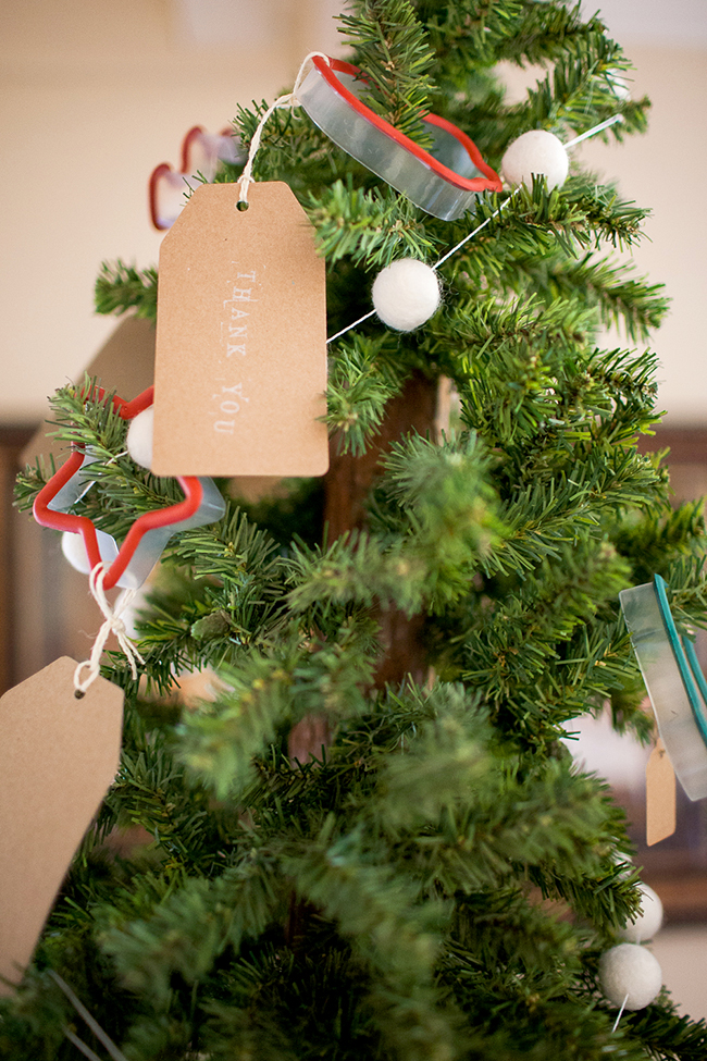 Give your guests a cute cookie cutter at your Cookie Exchange Party! Hang them on a small tree as ornaments, and let your guests choose one at the end of the party. 