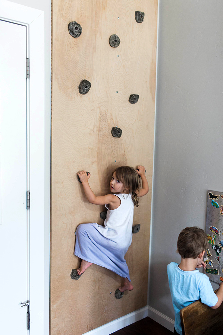A rock climbing wall in the playroom?! LOVE this idea! 