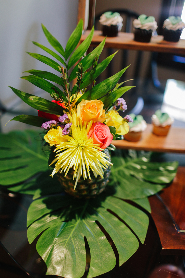 These palm leaves are such a great way to decorate! Use pineapples as vases for your tropical party decor. 