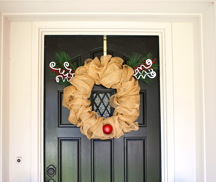 Decorate your front door for Christmas with this cute Rudolph Wreath. This is an easy project using a pool noodle. Make your own Christmas wreath for $10. 