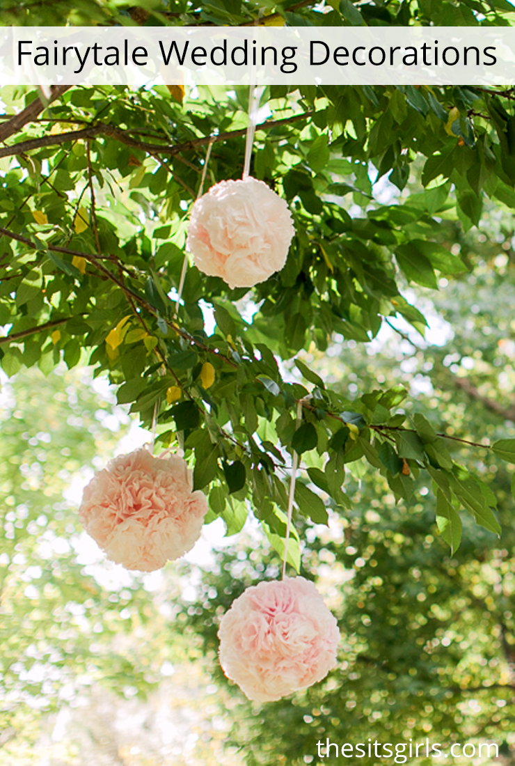 Fairytale wedding decor - love how pretty these flower balls look hanging from the trees.