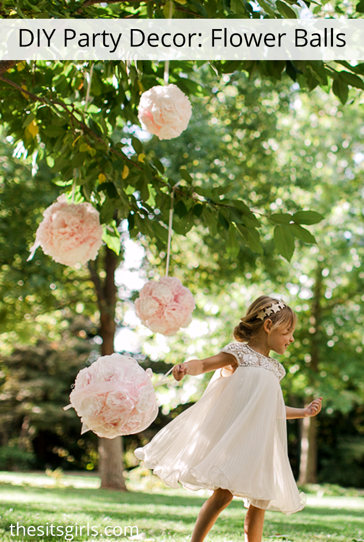 DIY Flower Balls | Learn how to make hanging flower balls out of coffee filters for party decor, photo shoots, or wedding decor. Includes step by step instructions and video tutorial. These are so easy to make!