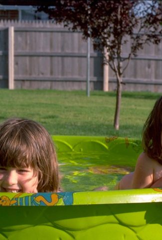 Sisters at home in backyard