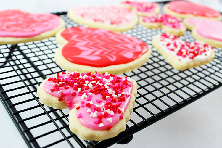 Perfect sugar cookies with marbleized frosting and sprinkles. Perfect for Valentine's Day.