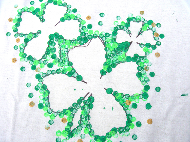 Use your pencil to make dots all around the clover cut outs. 