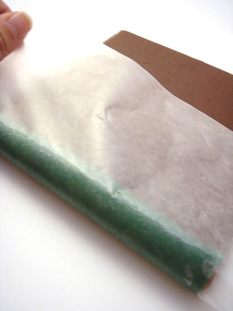 Carefully roll your dough up using wax paper.