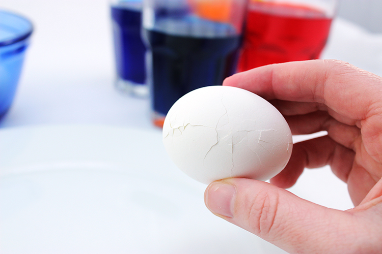 Crack your hard boiled eggs before coloring them to make Magic Mosaic Easter Eggs.