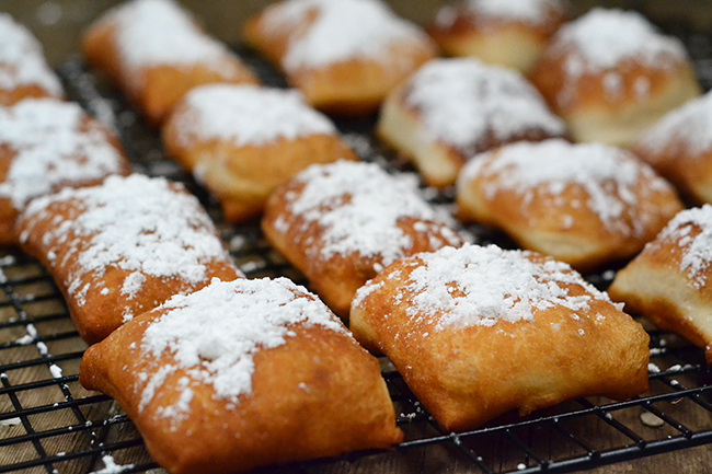 Always top off your homemade beignets with a generous sprinkling of powdered sugar!
