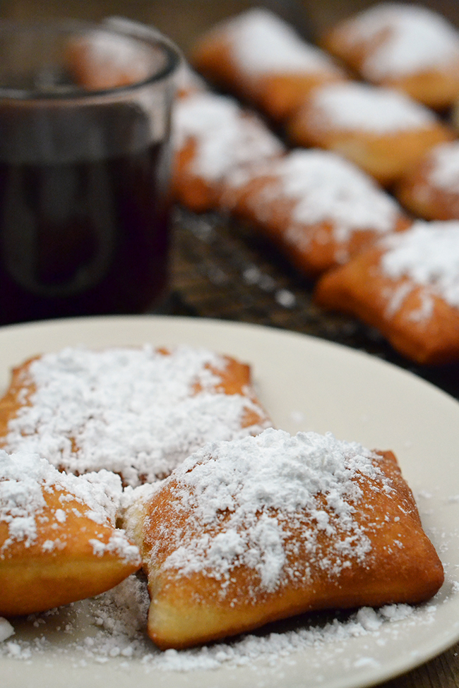 This easy hack for making homemade beignets will have you eating powered sugary goodness in minutes - no waiting for dough to rise! 