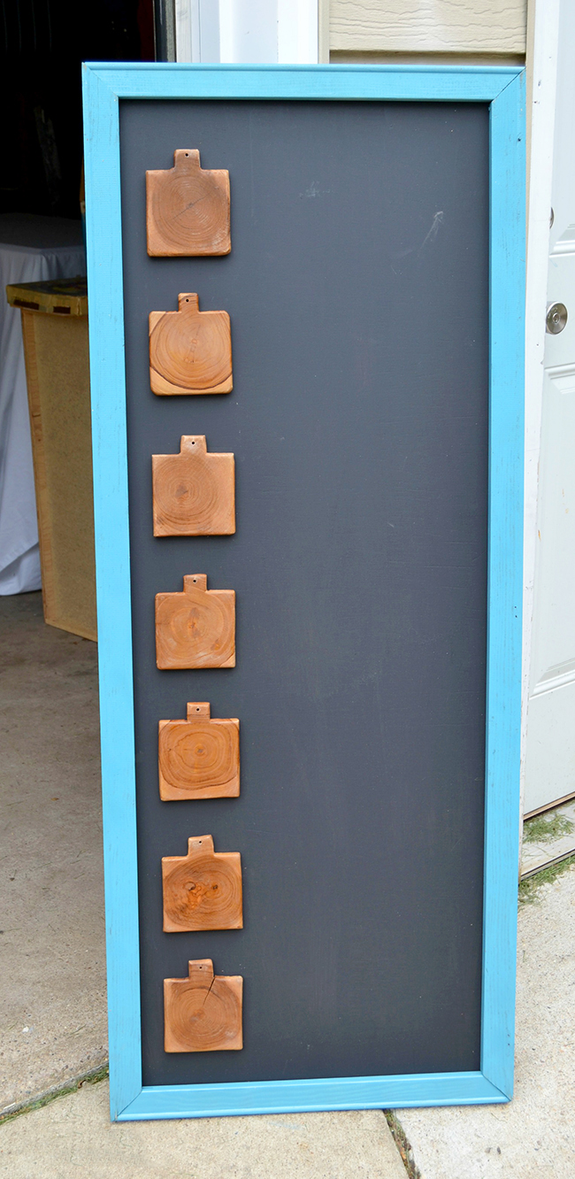 Pieces of wood attached to your menu board (I used coasters!) serve as markers for each day of the week | Diy Menu Board