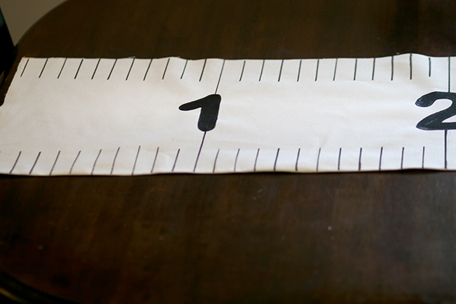 Adding the numbers really makes this table runner look like a ruler. Perfect back to school party decoration idea.