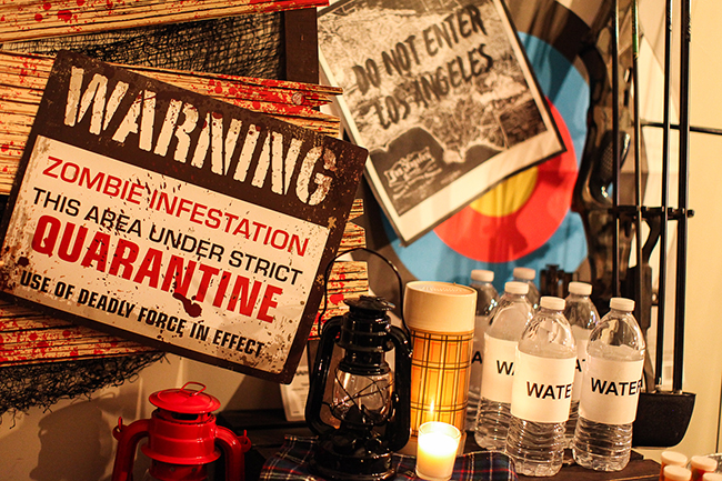 Fear the Walking Dead Party| Decorating with household items is a great way to save money on decor, and reuse things in a different way. Use some basics to create a spooky survival table for the next zombie infestation!