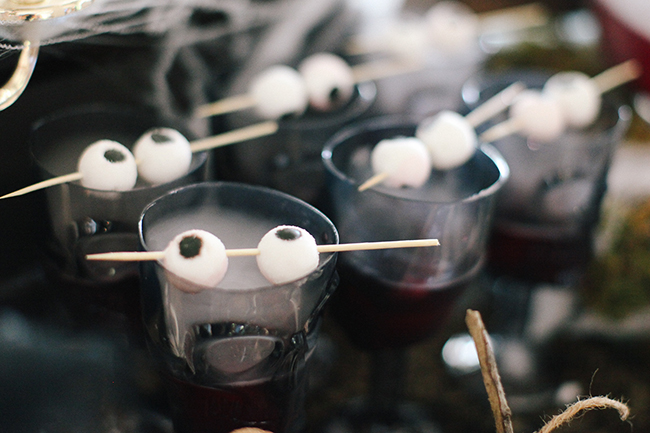 Use dry ice and gummy eyeballs to serve up a bone chilling drink this Halloween!