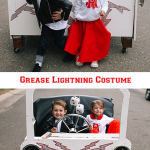 Kids dressed as Danny and Sandy with grease lightning car