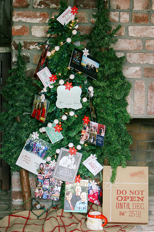 Display your Christmas cards on a tree. This is an easy way to display your cards and decorate your Christmas tree!