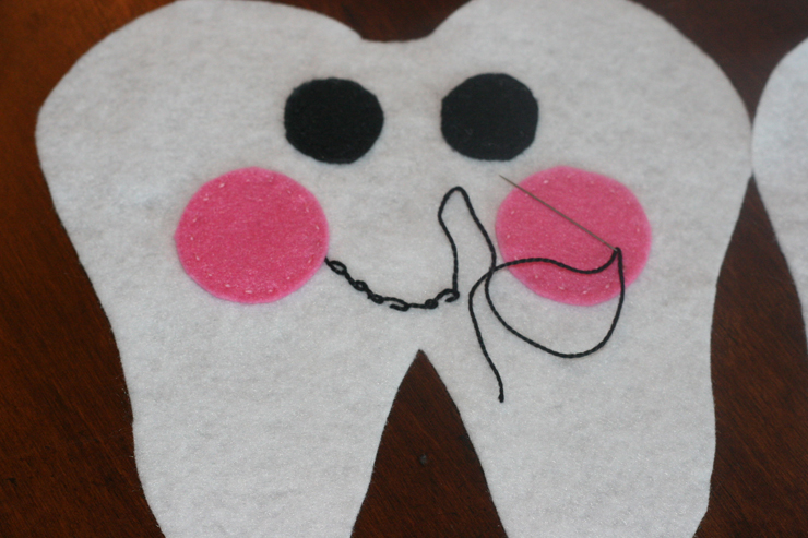 Stitch a happy smile on the front of your Tooth Fairy pillow.