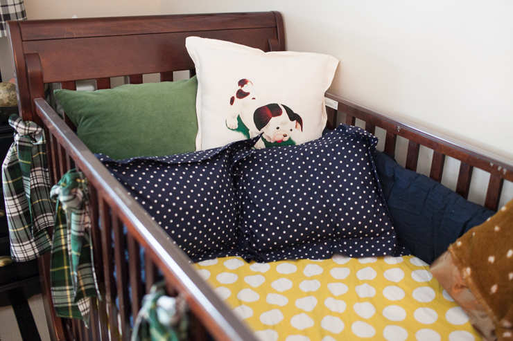 Mix and match patterns in your crib. Love the cute Pokey Puppy pillow for a baby boy's nursery.