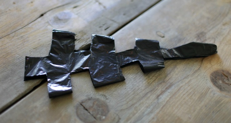 example of a folded and cut trash bag for making a spider web