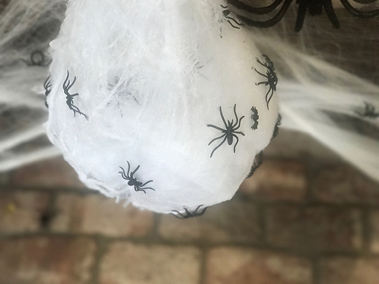 Use a balloon and spiderwebs to make these spider eggs.