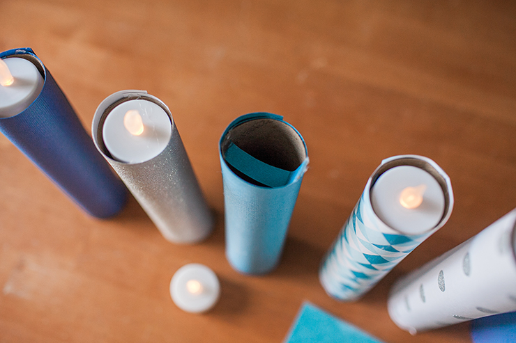 Use a strip of paper to create a cradle for a flameless LED candle to sit in.