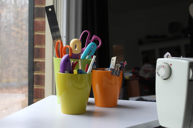 Clearance planters make great storage containers for sewing tools.