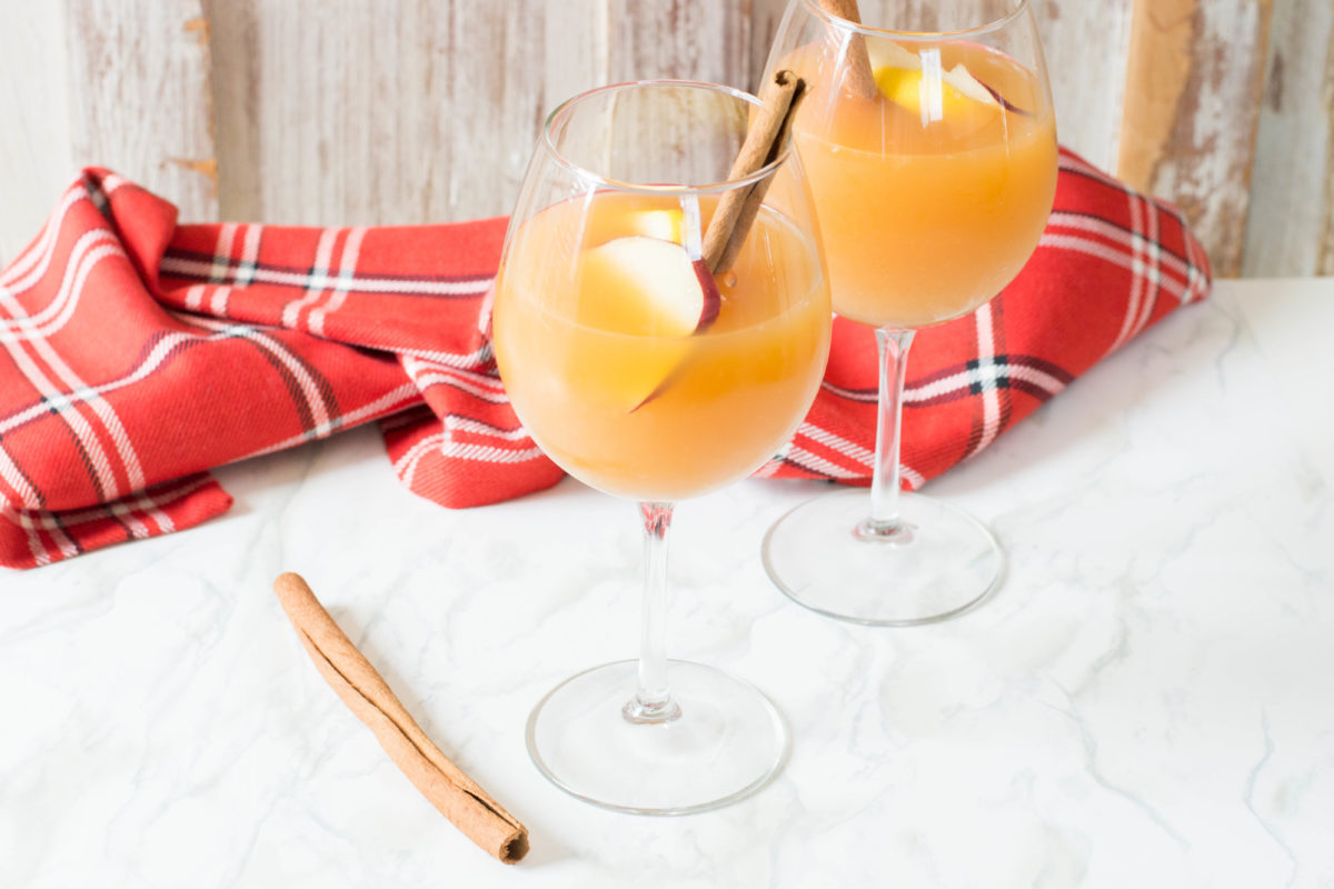 Apple Cider Sangria uses just a handful of ingredients, and is perfectly crisp and refreshing for fall. Make this recipe for all of your fall get togethers!