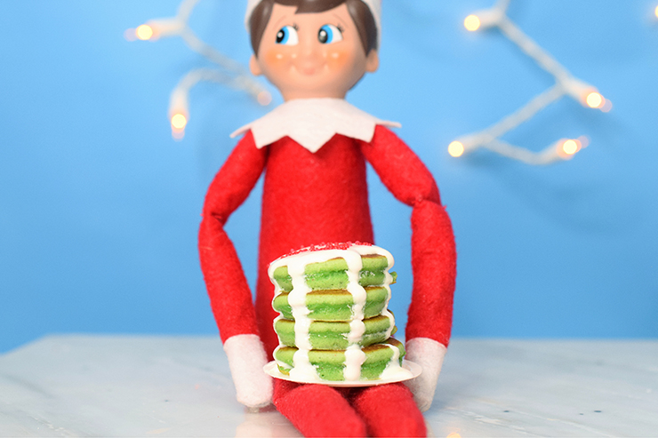 stack of green pancakes with icing 