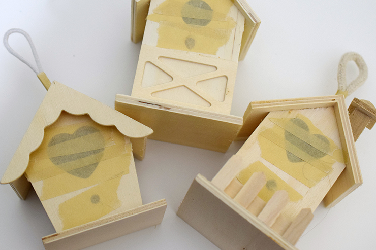 birdhouses with masking tape covering holes