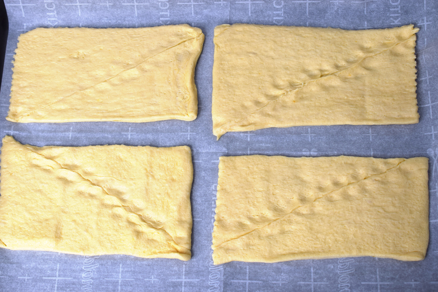 Crescent rolls separated into rectangles.