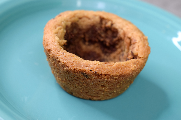 Cookie cup sitting on blue plate.