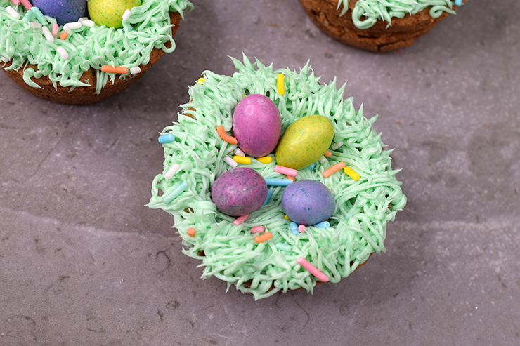 Cookie cup nest with candy eggs and sprinkles.