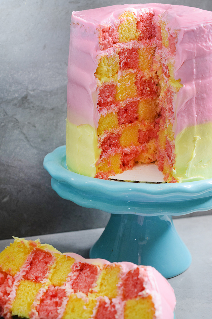 Checkerboard cake with strawberry and lemonade flavors in pink and yellow.